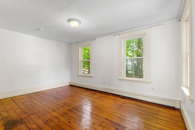 956 Bay Rd Unit 1, Hamilton, MA 01982 - unfurnished room featuring baseboard heating, plenty of natural light, hardwood / wood-style floors, and baseboards
