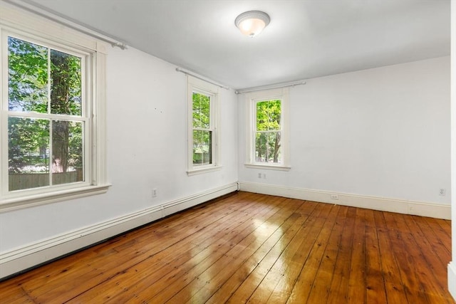 956 Bay Rd Unit 1, Hamilton, MA 01982 - spare room featuring a baseboard radiator, baseboards, and wood-type flooring