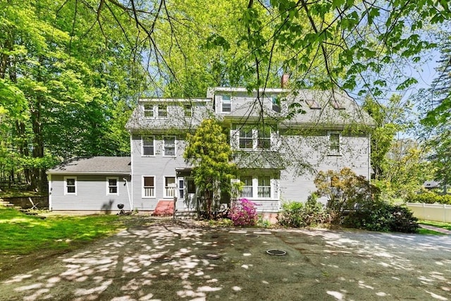 956 Bay Rd Unit 1, Hamilton, MA 01982 - rear view of house with a chimney and fence