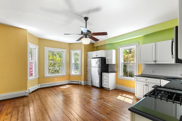 956 Bay Rd Unit 1, Hamilton, MA 01982 - kitchen with freestanding refrigerator, dark countertops, white cabinetry, baseboards, and a ceiling fan