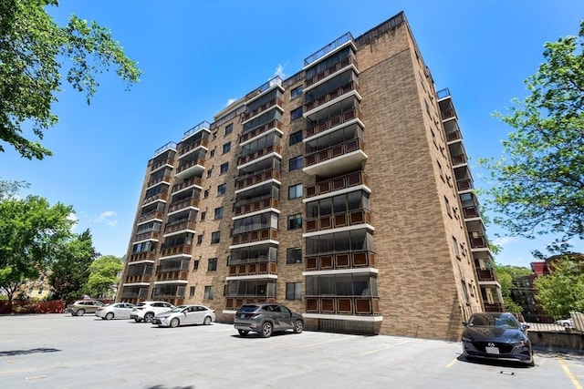 990 Massachusetts Ave Unit A37, Arlington, MA 02476 - view of apartment building / complex featuring uncovered parking