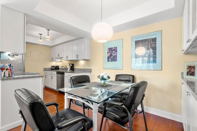 990 Massachusetts Ave Unit A37, Arlington, MA 02476 - dining space with a tray ceiling and dark wood finished floors