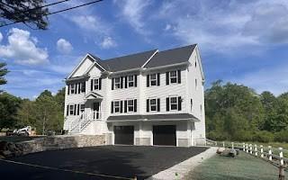 58 Dudley Rd, Billerica, MA 01821 - view of front of property featuring a garage and driveway