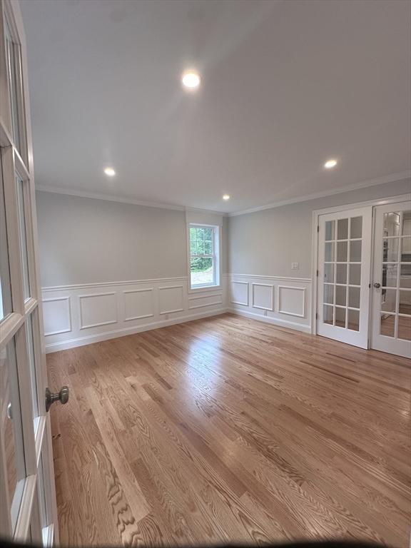 58 Dudley Rd, Billerica, MA 01821 - empty room featuring ornamental molding, a decorative wall, a wainscoted wall, french doors, and recessed lighting
