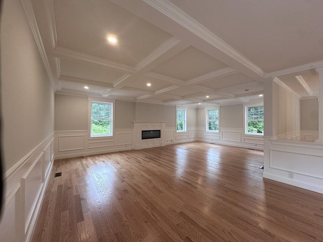 58 Dudley Rd, Billerica, MA 01821 - unfurnished living room with a decorative wall, beam ceiling, recessed lighting, a glass covered fireplace, and coffered ceiling