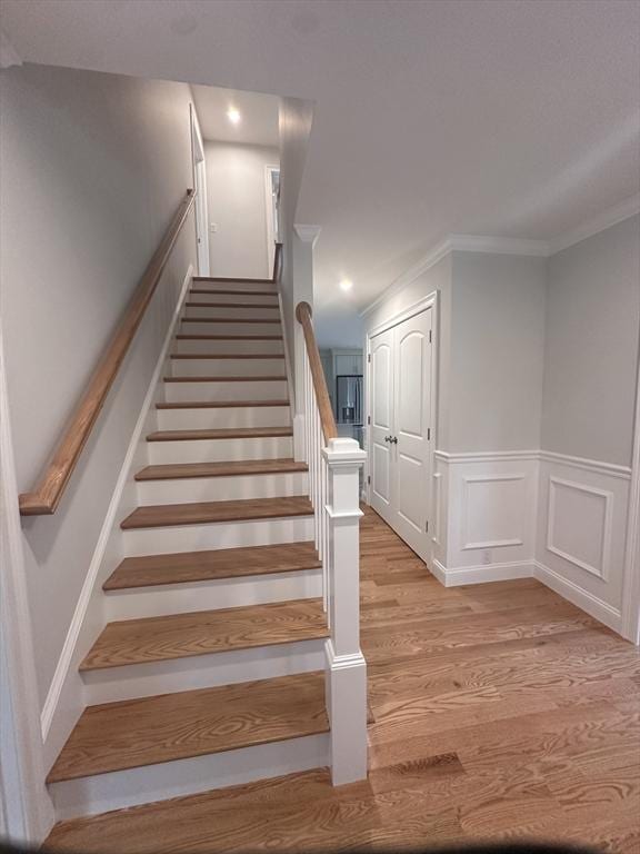 58 Dudley Rd, Billerica, MA 01821 - staircase featuring wood finished floors, wainscoting, ornamental molding, and recessed lighting