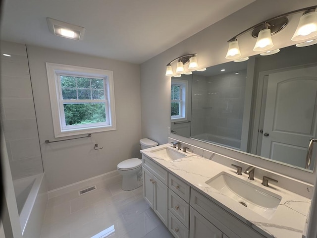 58 Dudley Rd, Billerica, MA 01821 - full bath with double vanity, toilet, baseboards,  shower combination, and tile patterned floors