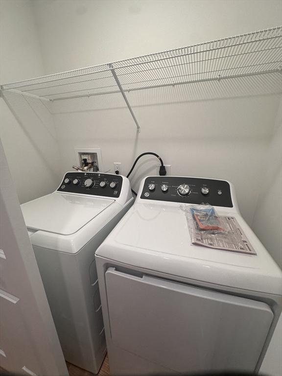 58 Dudley Rd, Billerica, MA 01821 - laundry area featuring washing machine and dryer and wood finished floors