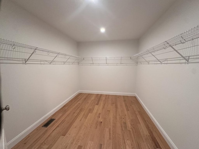 58 Dudley Rd, Billerica, MA 01821 - walk in closet with light wood-type flooring