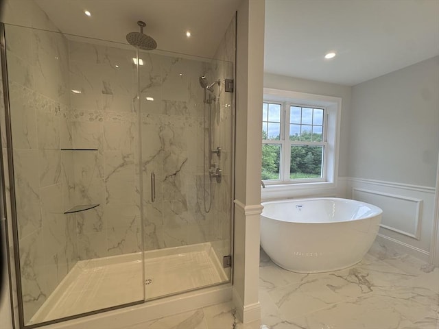 58 Dudley Rd, Billerica, MA 01821 - bathroom featuring marble tiled floors, a freestanding tub, a marble finish shower, recessed lighting, and a wainscoted wall