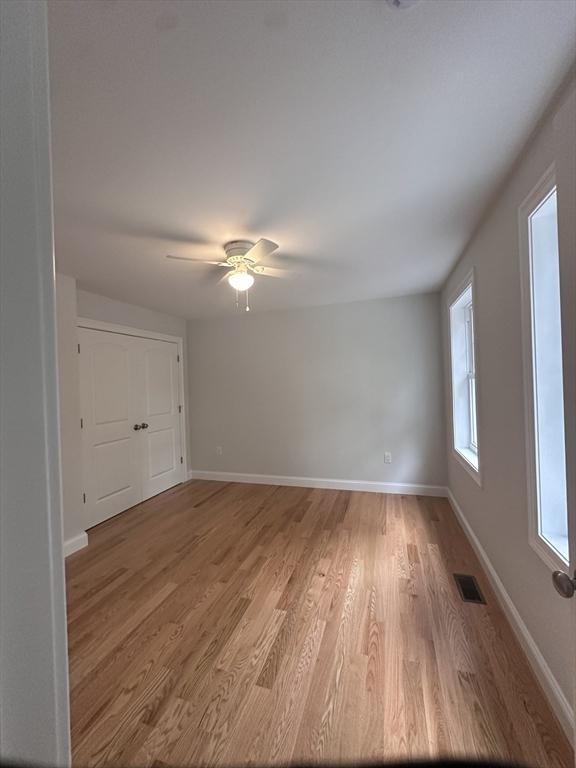 58 Dudley Rd, Billerica, MA 01821 - empty room with light wood-type flooring, baseboards, and a ceiling fan