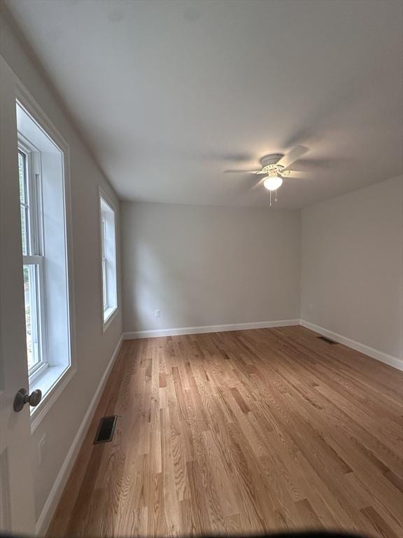 58 Dudley Rd, Billerica, MA 01821 - empty room with light wood-style flooring, baseboards, and a ceiling fan