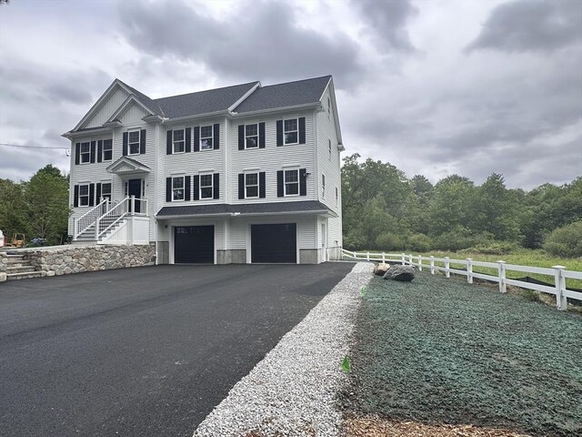 58 Dudley Rd, Billerica, MA 01821 - view of property with a garage and driveway
