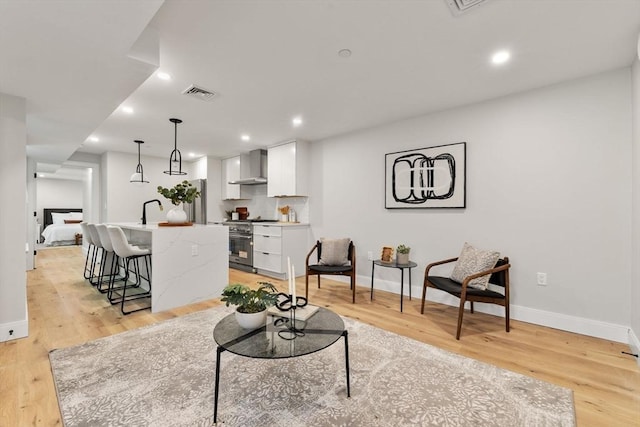 190 Salem St Unit 2, Boston, MA 02113 - living room featuring baseboards, light wood finished floors, and recessed lighting