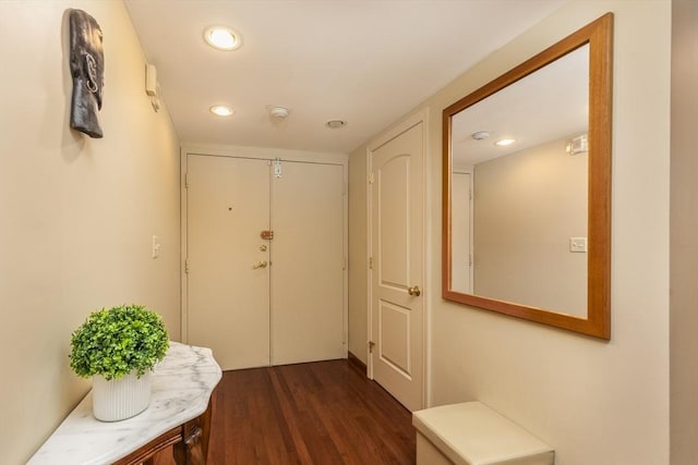 doorway to outside featuring recessed lighting and dark wood-style flooring