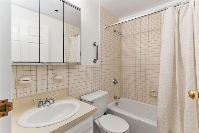 357 Commercial St Unit 219, Boston, MA 02109 - bathroom with shower / tub combo with curtain, vanity, toilet, tile walls, and backsplash