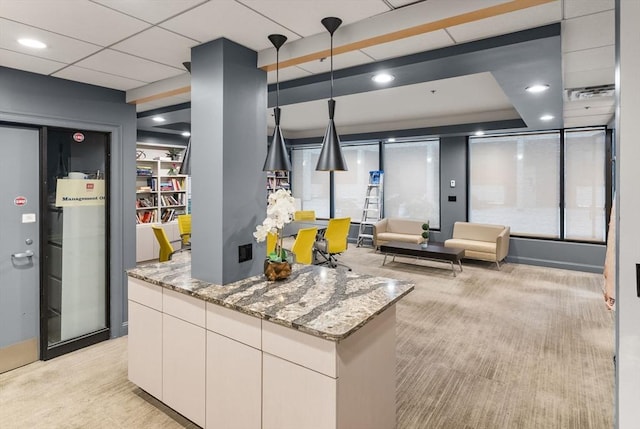 357 Commercial St Unit 219, Boston, MA 02109 - kitchen with light stone countertops, light carpet, and recessed lighting