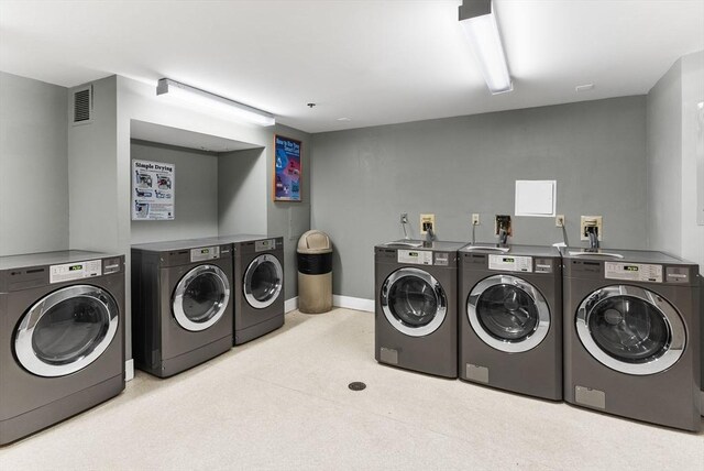 357 Commercial St Unit 219, Boston, MA 02109 - shared laundry room with independent washer and dryer and baseboards