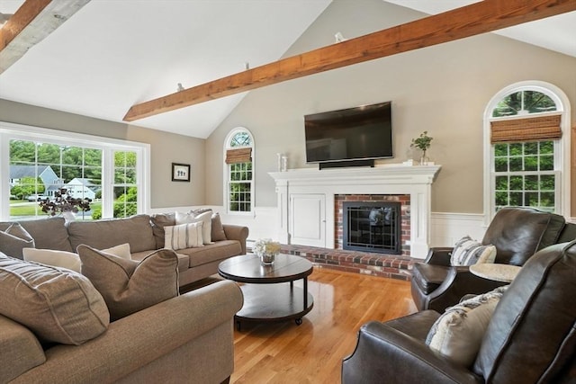 56 R F Higgins Dr, Norwell, MA 02061 - living room featuring beam ceiling, wainscoting, wood finished floors, plenty of natural light, and a fireplace