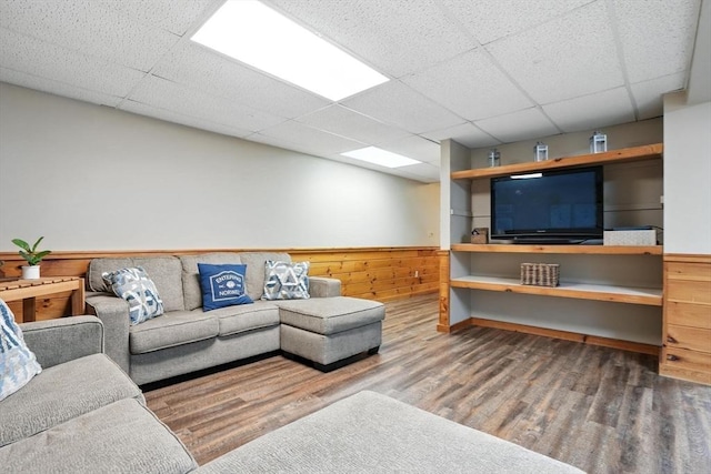 56 R F Higgins Dr, Norwell, MA 02061 - living room featuring a paneled ceiling, wood finished floors, wainscoting, and wooden walls