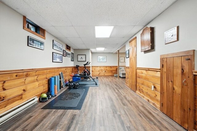 56 R F Higgins Dr, Norwell, MA 02061 - workout area featuring wood finished floors, wainscoting, a drop ceiling, and wood walls