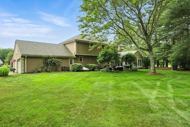 56 R F Higgins Dr, Norwell, MA 02061 - view of grassy yard featuring an attached garage