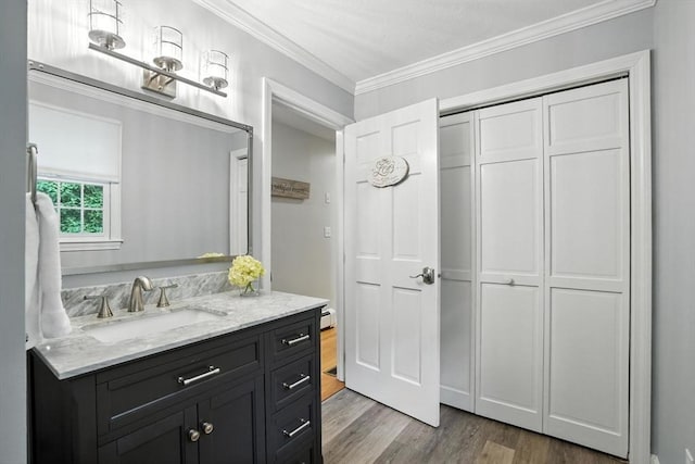 56 R F Higgins Dr, Norwell, MA 02061 - bathroom with wood finished floors, vanity, and ornamental molding