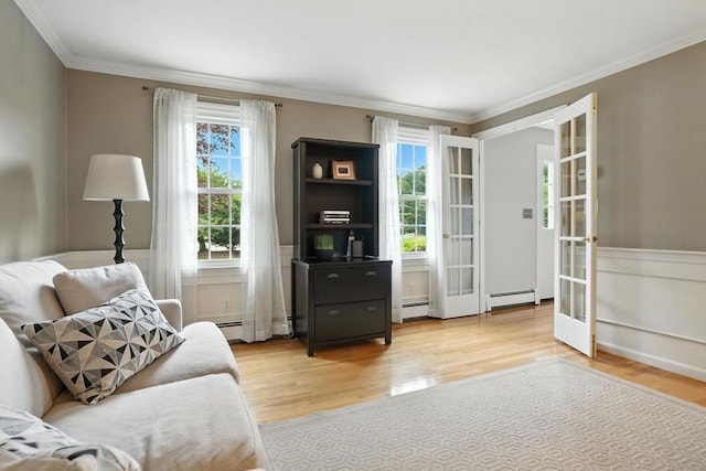 56 R F Higgins Dr, Norwell, MA 02061 - living area with light wood-style floors, plenty of natural light, a baseboard heating unit, french doors, and crown molding