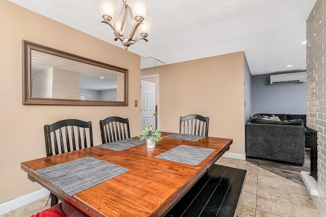 dining space featuring a chandelier, light tile patterned floors, baseboards, and a wall mounted AC