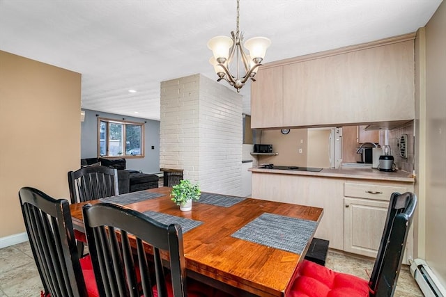 dining space featuring a chandelier, a baseboard radiator, and baseboards