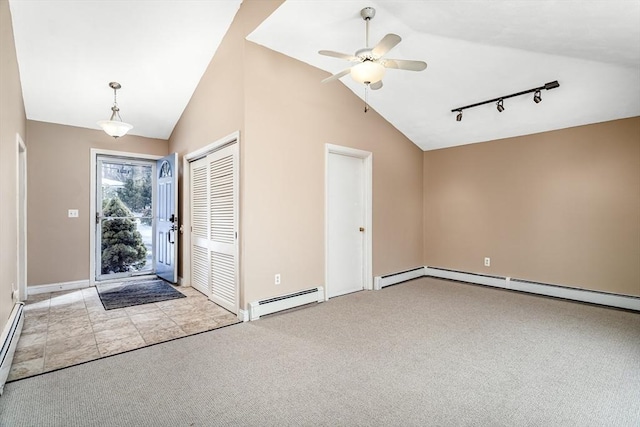 entrance foyer with baseboard heating, rail lighting, a ceiling fan, and light colored carpet