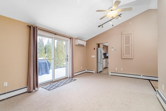 empty room with lofted ceiling, baseboard heating, and a wall mounted air conditioner