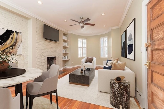 15 Blackwood Unit 2, Boston, MA 02115 - living area featuring light wood-style floors, a fireplace, recessed lighting, a ceiling fan, and crown molding