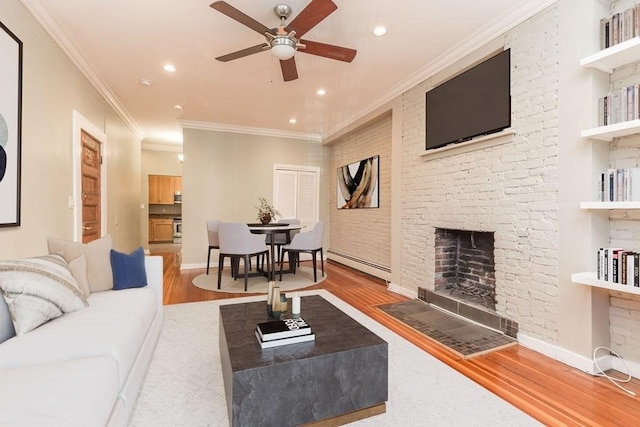 15 Blackwood Unit 2, Boston, MA 02115 - living area with baseboard heating, ceiling fan, wood finished floors, recessed lighting, and crown molding