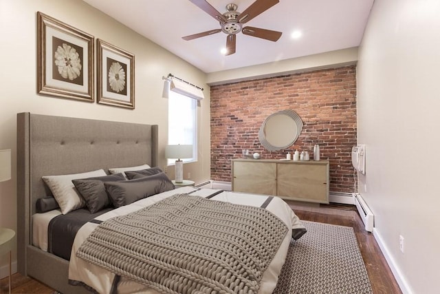 15 Blackwood Unit 2, Boston, MA 02115 - bedroom featuring a baseboard heating unit, wood finished floors, baseboards, brick wall, and ceiling fan