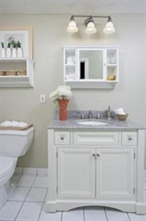 15 Blackwood Unit 2, Boston, MA 02115 - bathroom featuring vanity, toilet, tile patterned floors, and baseboards