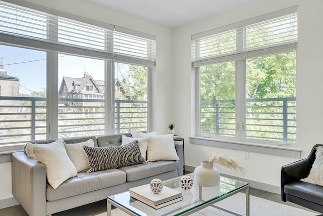 living room featuring a wealth of natural light and hardwood / wood-style floors