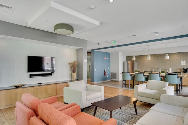 living room with light hardwood / wood-style floors