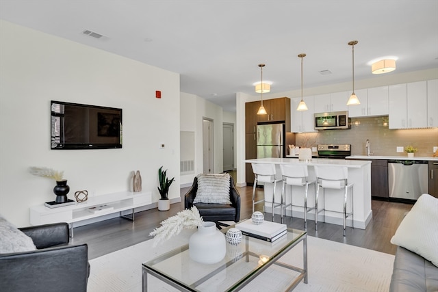 living room with dark wood-type flooring