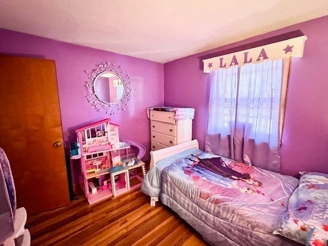 bedroom with wood-type flooring