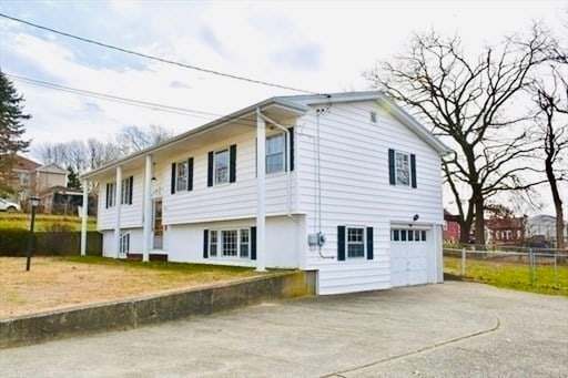 view of property exterior featuring a garage