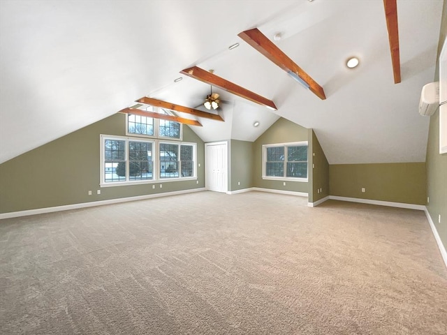 additional living space with a wall mounted AC, vaulted ceiling with beams, and light carpet