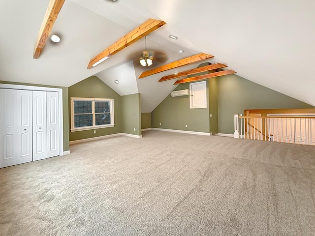 bonus room with an AC wall unit, vaulted ceiling with beams, and carpet flooring