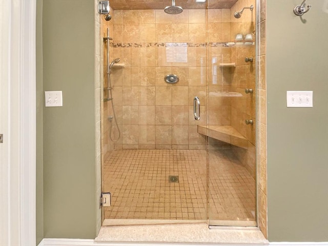 bathroom with a shower with shower door