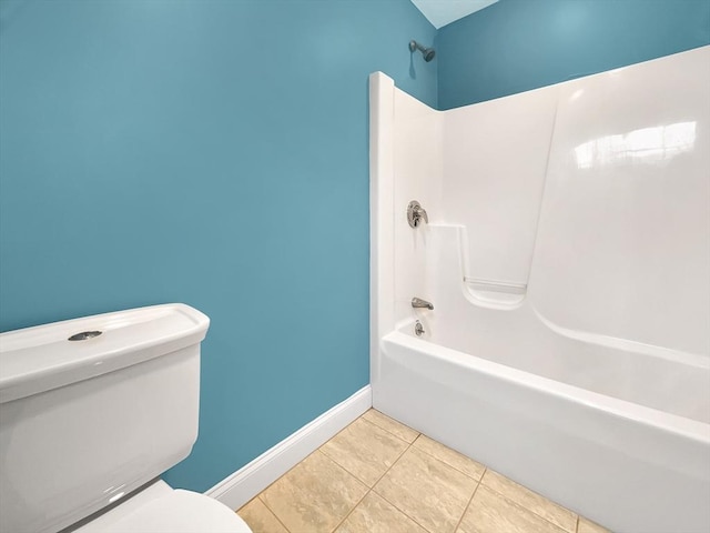 bathroom with tile patterned flooring,  shower combination, and toilet