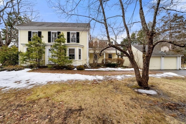 view of front of property with a garage and aphalt driveway