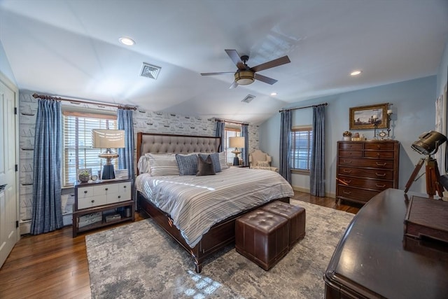 bedroom featuring ceiling fan, dark hardwood / wood-style floors, and vaulted ceiling