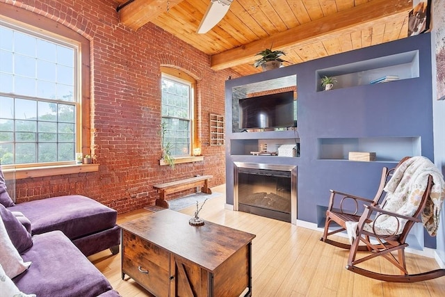 1511 Main St Unit C406, Worcester, MA 01603 - living area featuring brick wall, hardwood / wood-style floors, a wood ceiling with exposed beams, built in features, and a fireplace
