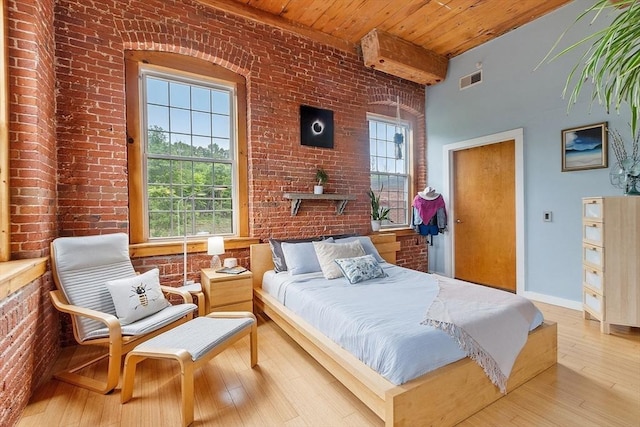 1511 Main St Unit C406, Worcester, MA 01603 - bedroom with brick wall and wood-type flooring