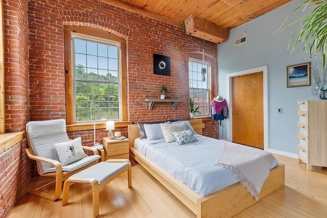 1511 Main St Unit C406, Worcester, MA 01603 - bedroom featuring brick wall and wood-type flooring